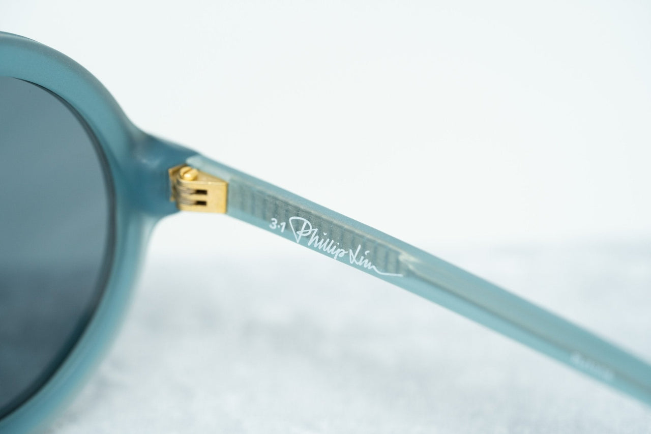 Phillip Lim Sunglasses with Round Blue Brushed Gold and Navy Blue Lenses - PL11C16SUN - Watches & Crystals